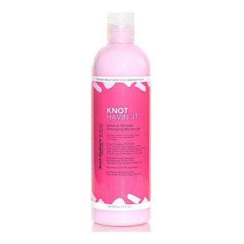 a bottle of pink liquid on a white background